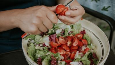 Making salad with tomatoes